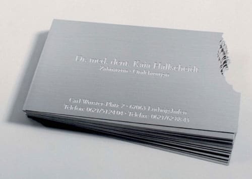 A business card for a dentist, made of metal and a corner bitten off. Not sure how cost effective it is but definitely eye catching.